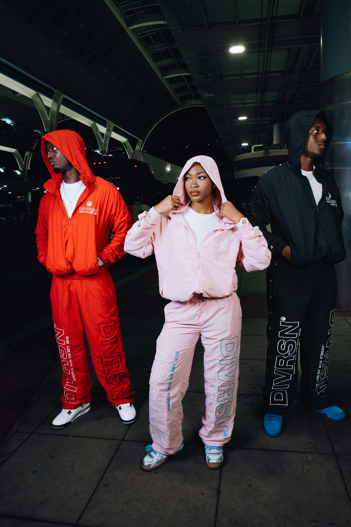People wearing coordinated relaxed travel sets